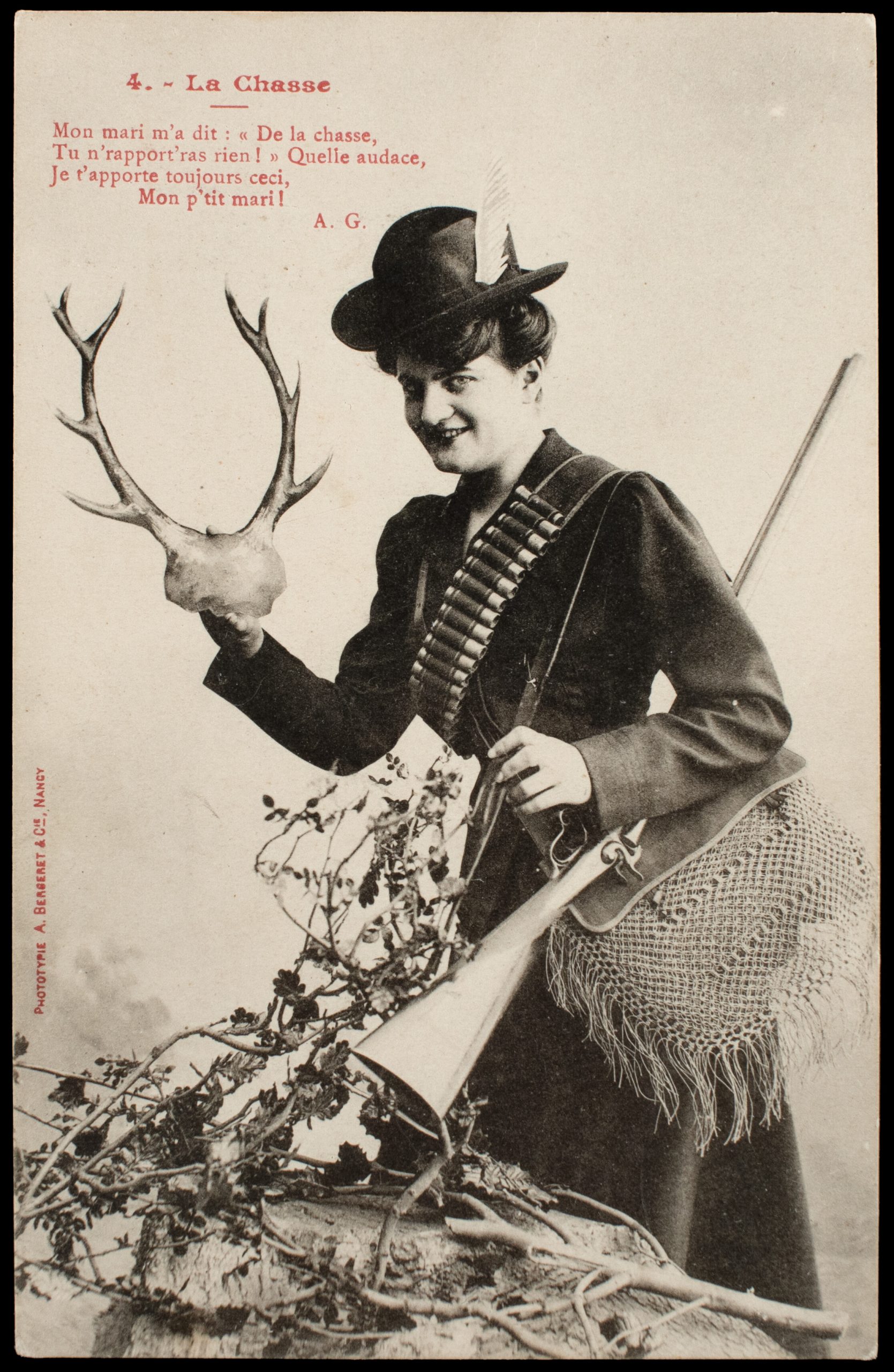 Comic French postcard showing a smiling female hunter holding antlers and a pinfire shotgun while wearing a centerfire shotshell bandolier.