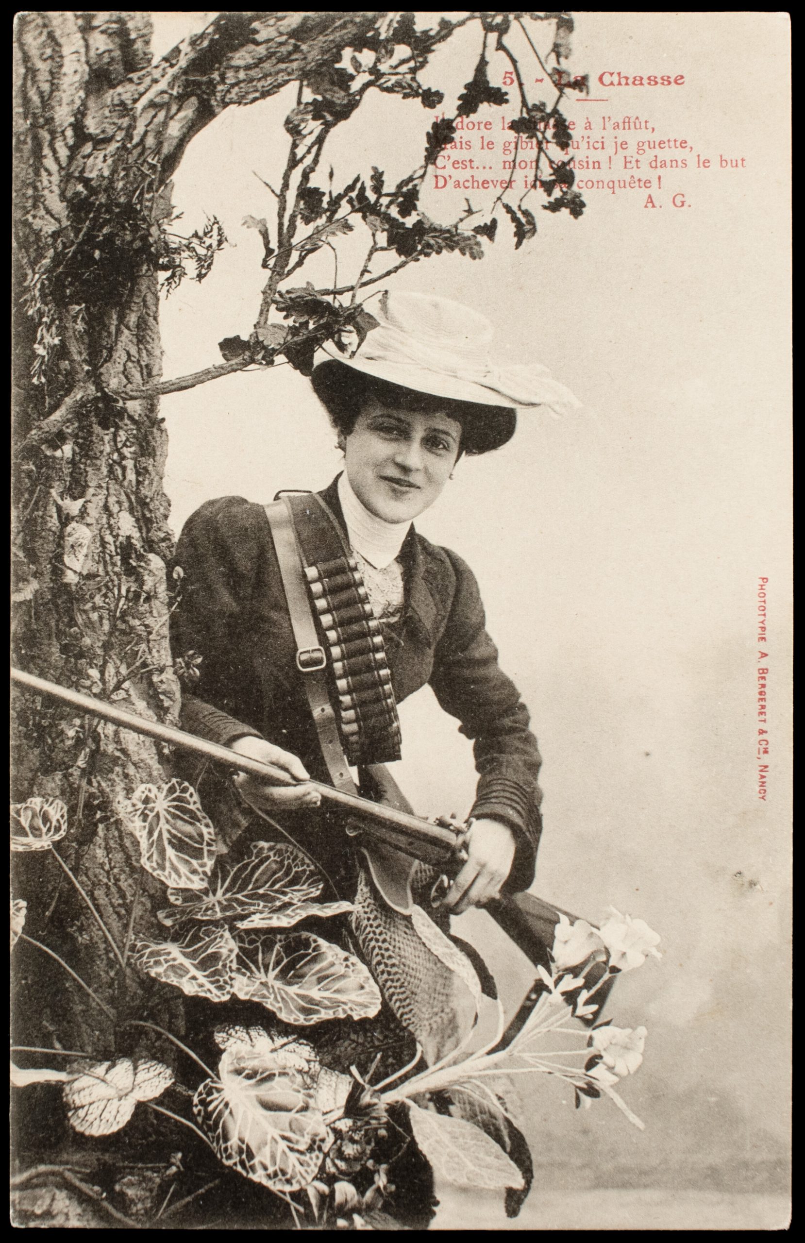 Comic French postcard showing a female hunter beside a studio tree with pinfire shotgun, shotshell bandolier, and game bag.