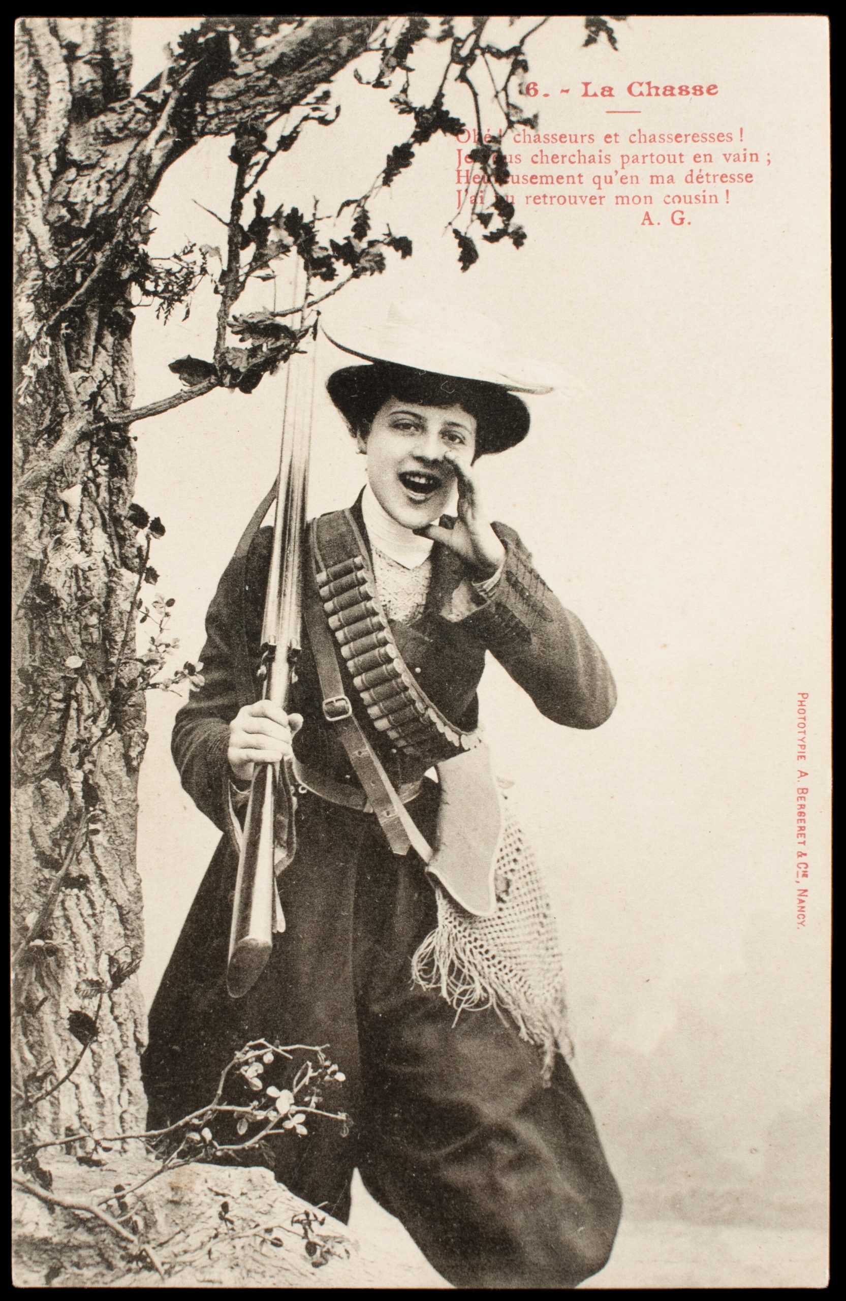Comic French postcard showing a laughing female hunter holding a side-by-side pinfire shotgun and wearing a centerfire shotshell bandolier.