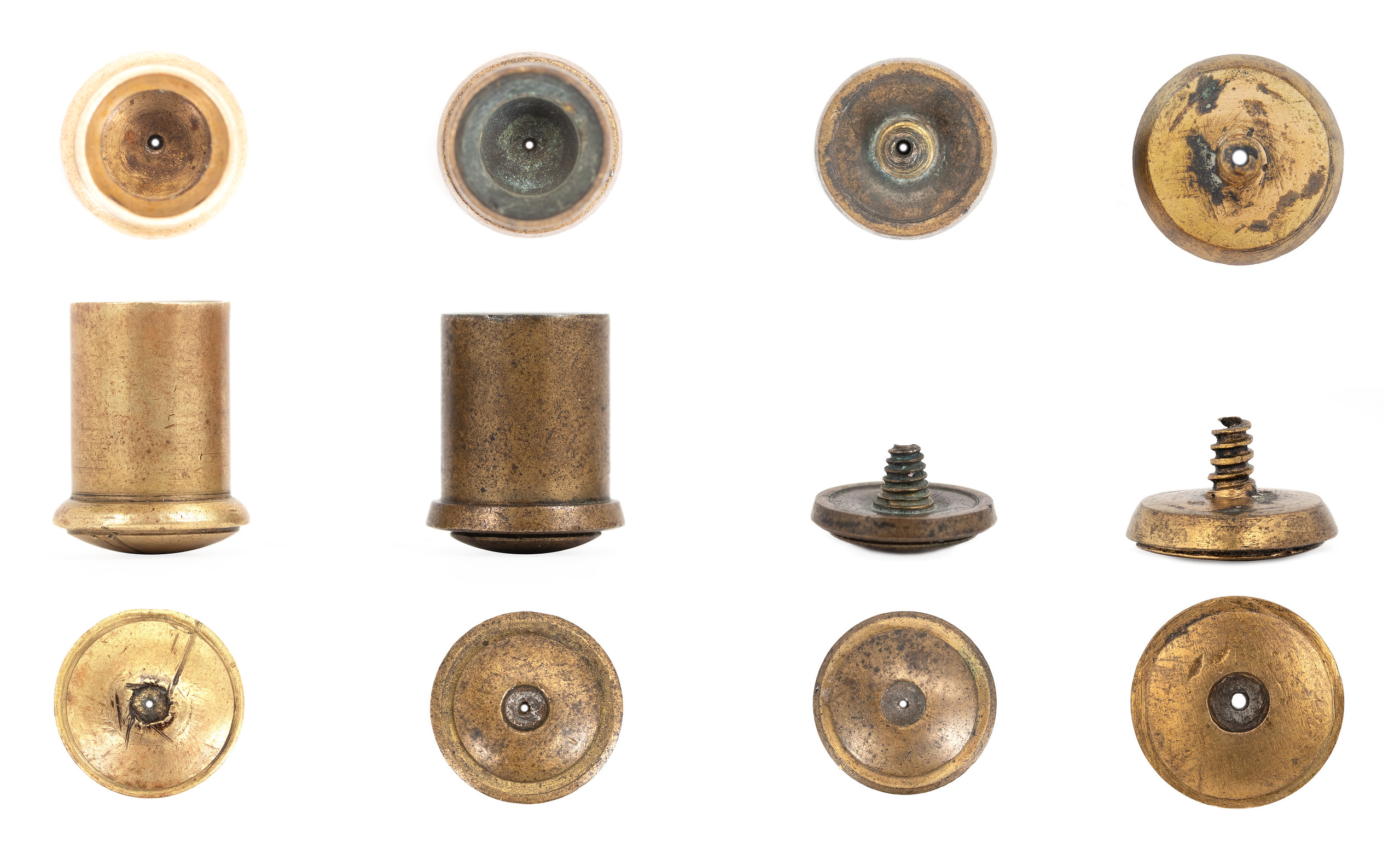 Four surviving Pauly-system cartridge bases, each shown from the interior, in profile, and from the rear. The deeper copper cups at left represent all-metal cartridge constructions suitable for pistols, while the flatter threaded rosettes at right were designed to attach to paper cartridge bodies. In both forms, the central opening carried ignition from the primer at the rear into the main powder charge.