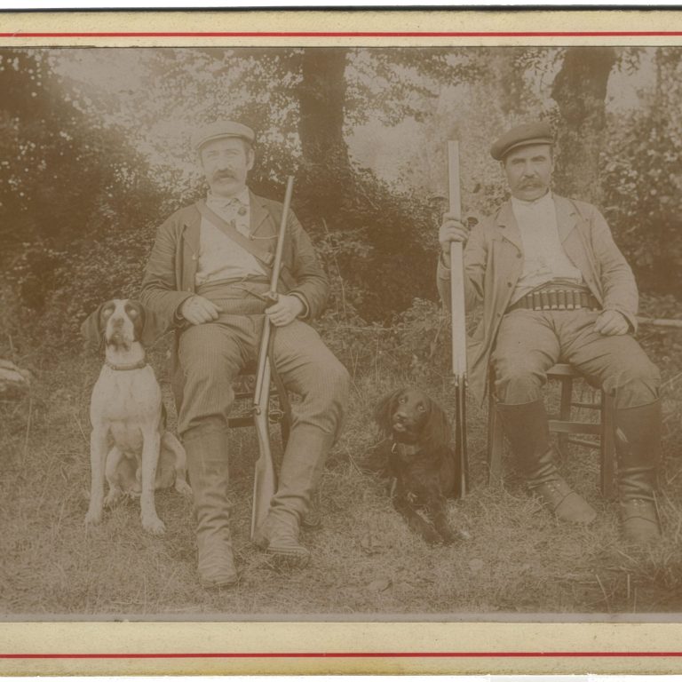 Hunters at Rest: Companions with Their Dogs in the Field